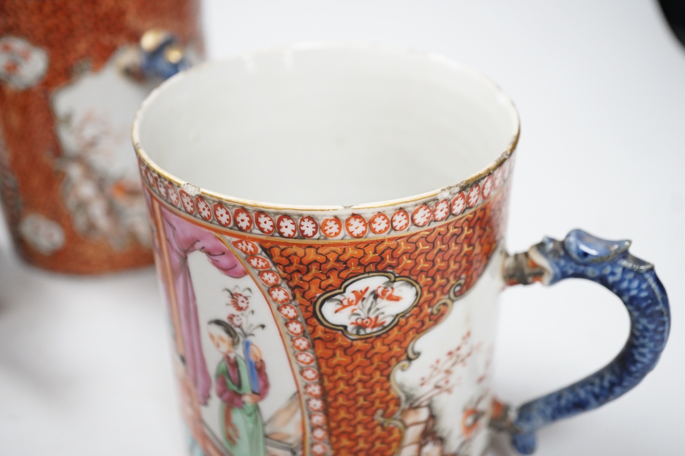 Two Chinese export 'mandarin' mugs and a similar teapot, Qianlong period, tallest mug 14cms high